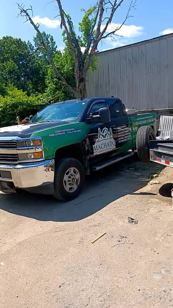 Machado Landscaping pickup truck with the green company wrap