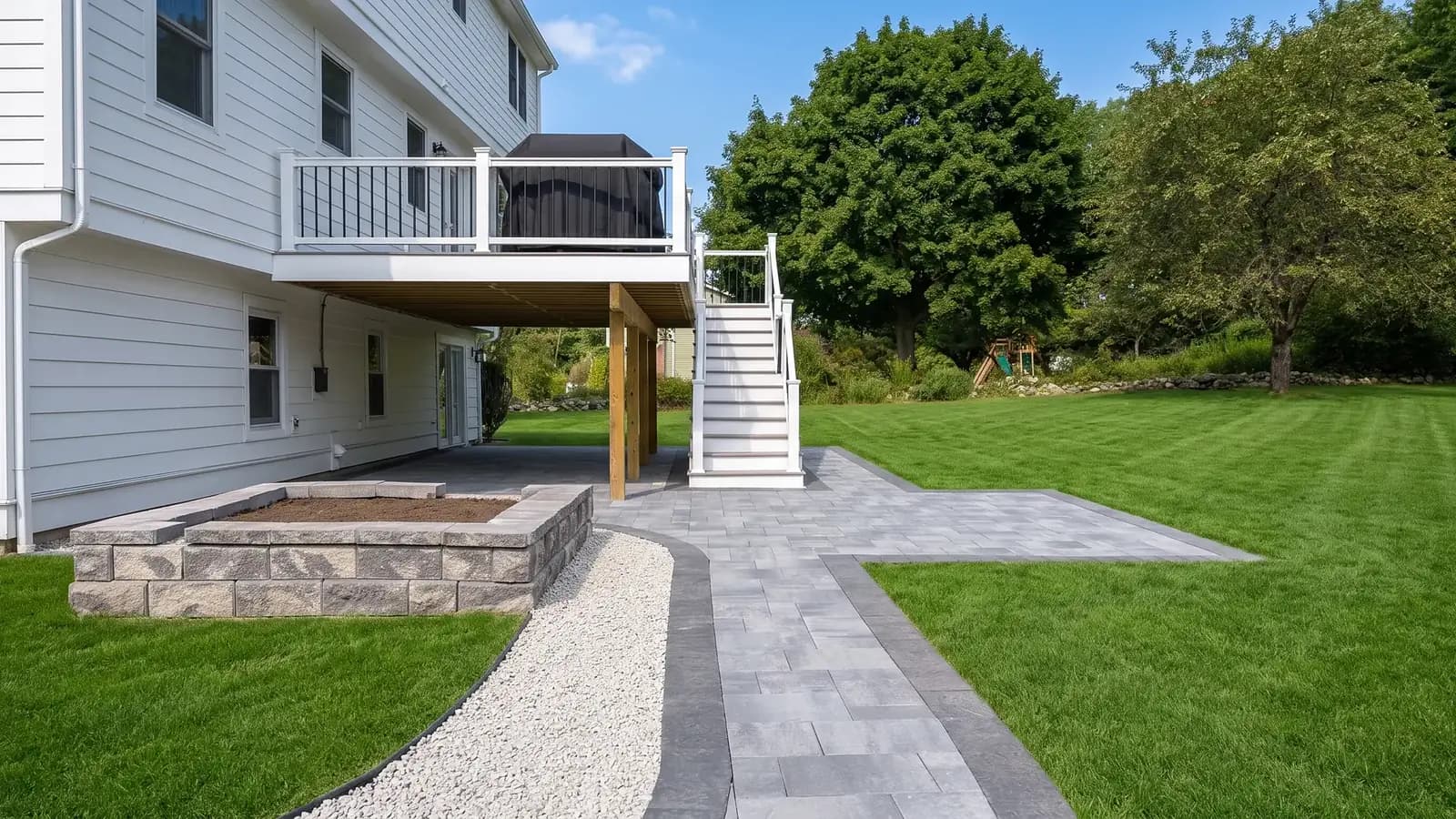 Paver patio and walkway under a deck